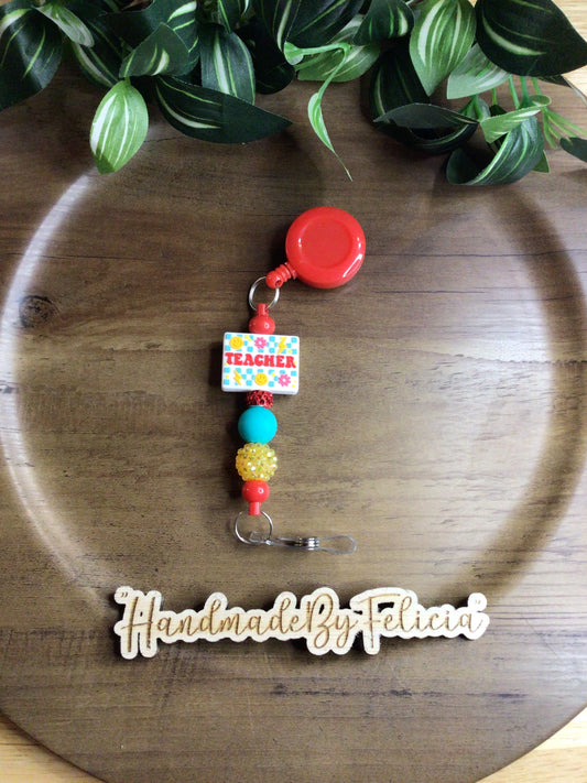 Red teacher badge reel