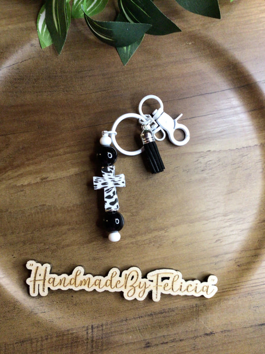 Black white cow pattern cross keychain