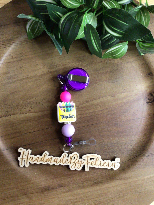 Purple teacher badge reel