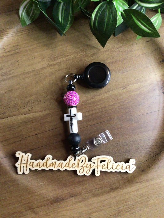 White cross badge reel