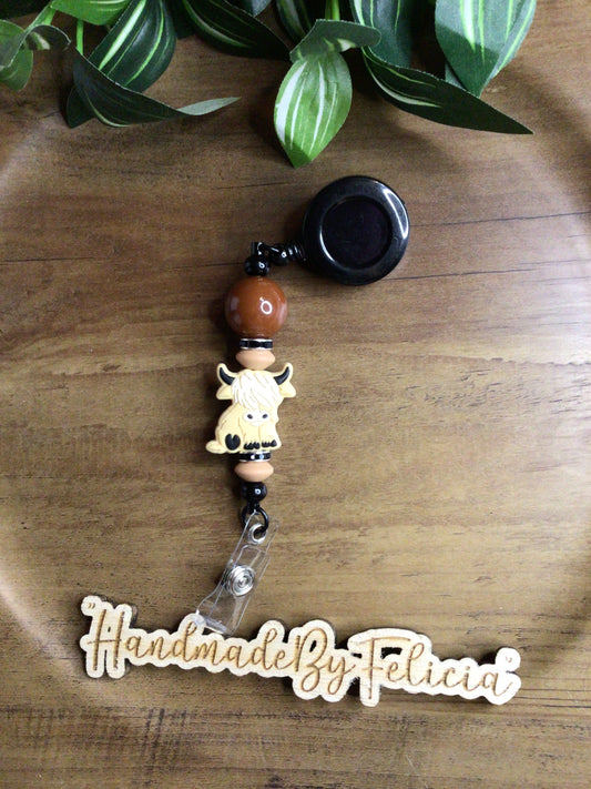 Highland cow brown badge reel