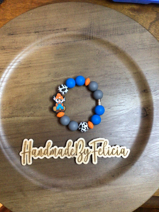 Orange hat cow cup charm