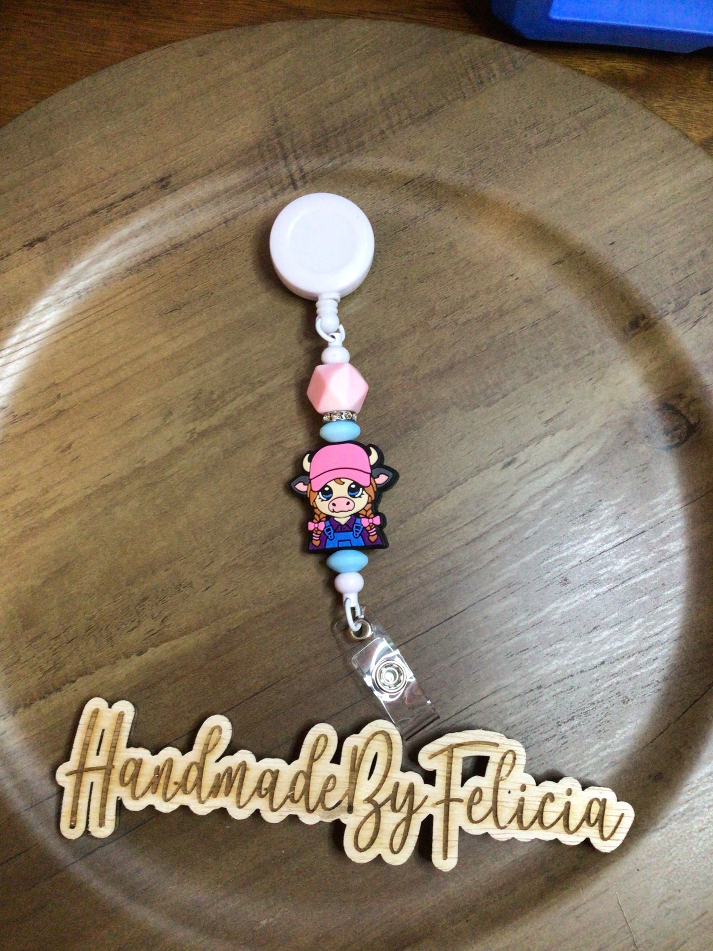Pink heifer badge reel