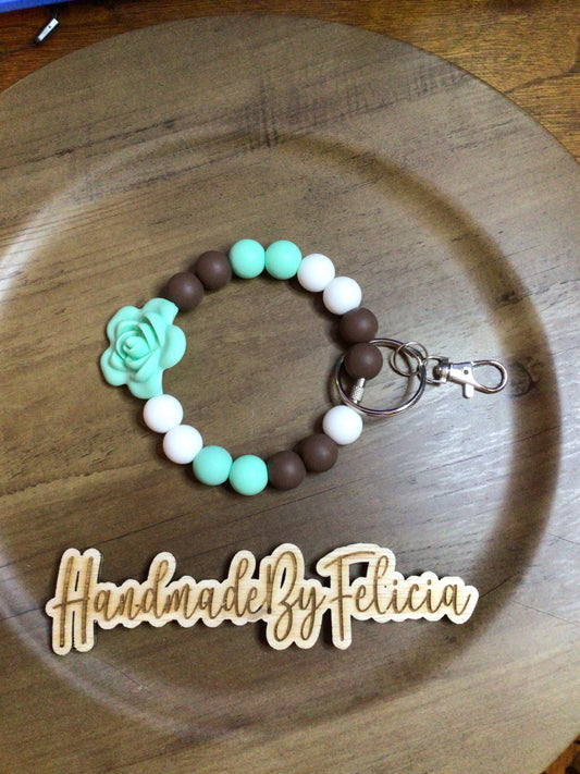 Mint green flower wristlet