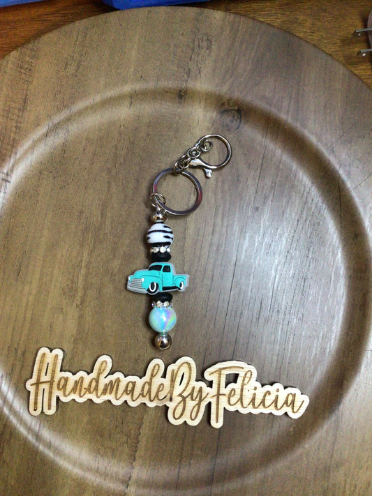 Turquoise truck with zebra bead keychain