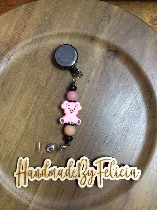 Pig badge reel neutral
