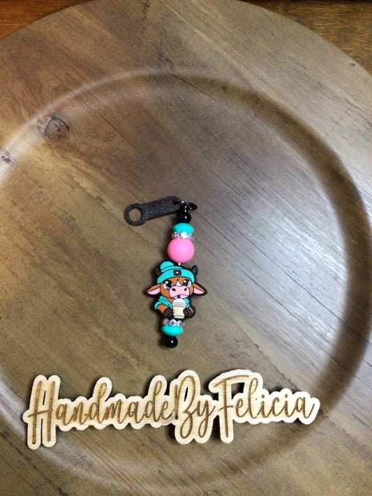 Teal cow with drink straw charm