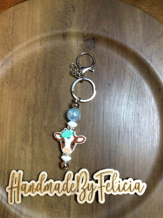 Brown cow keychain teal