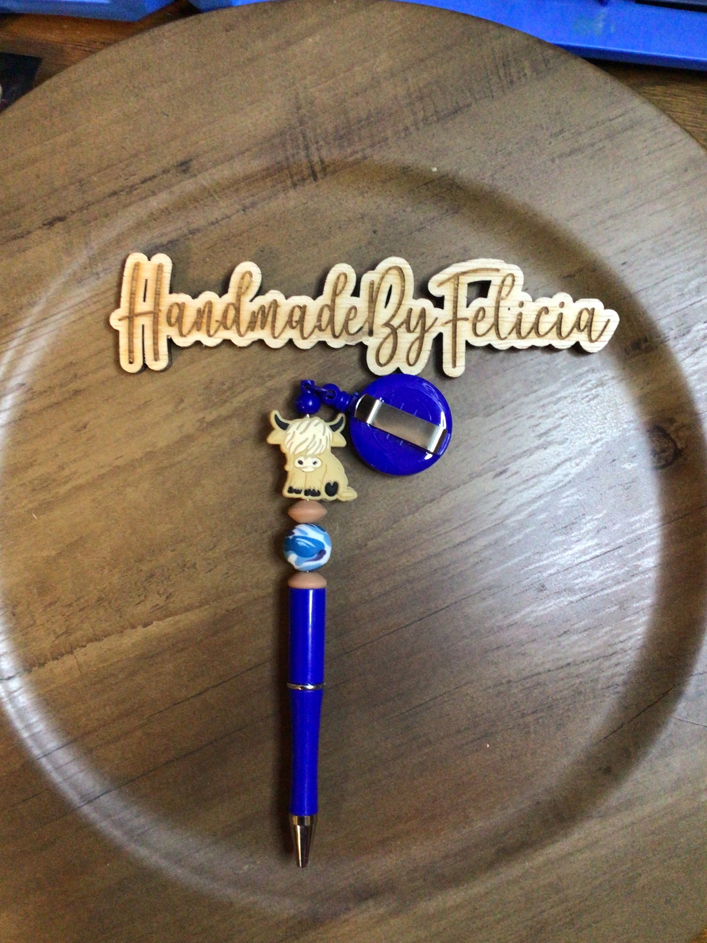 Blue highland cow badge reel and pen