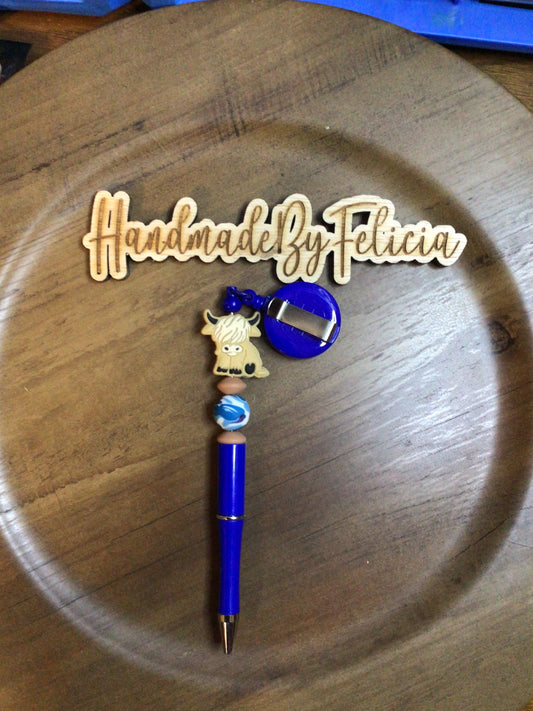Blue highland cow badge reel and pen