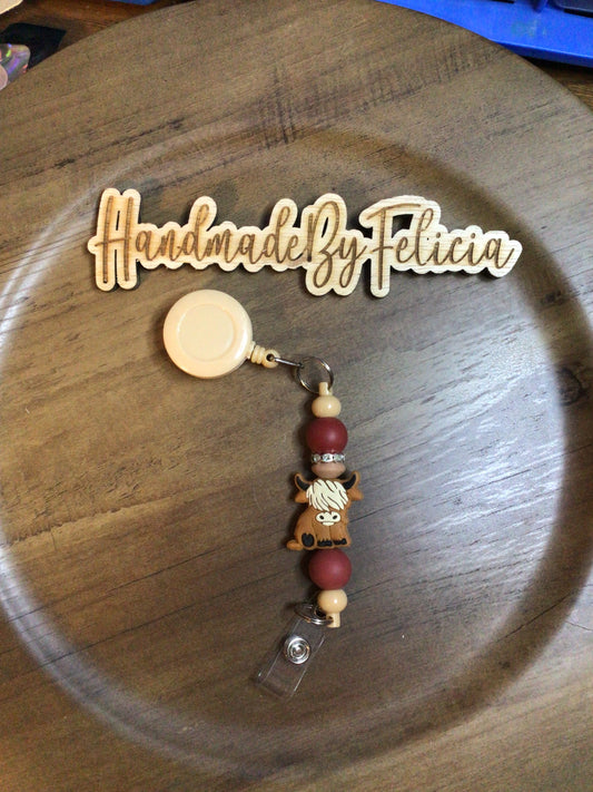 Highland cow tan badge reel