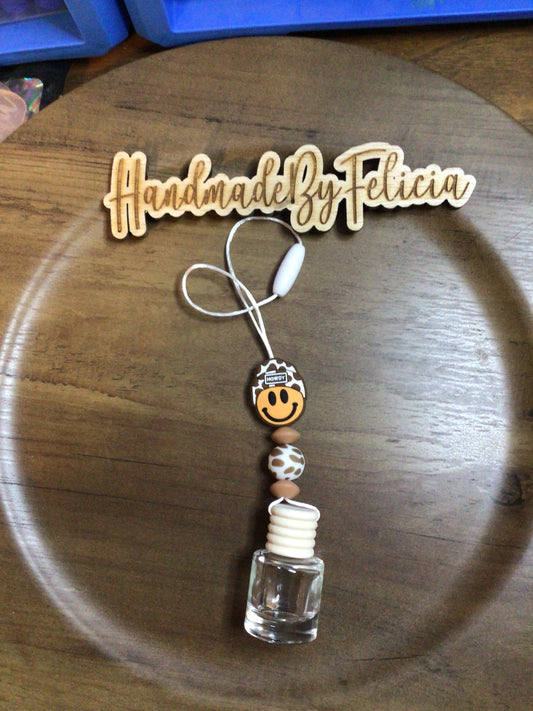 Brown cow smiley face freshie hanger