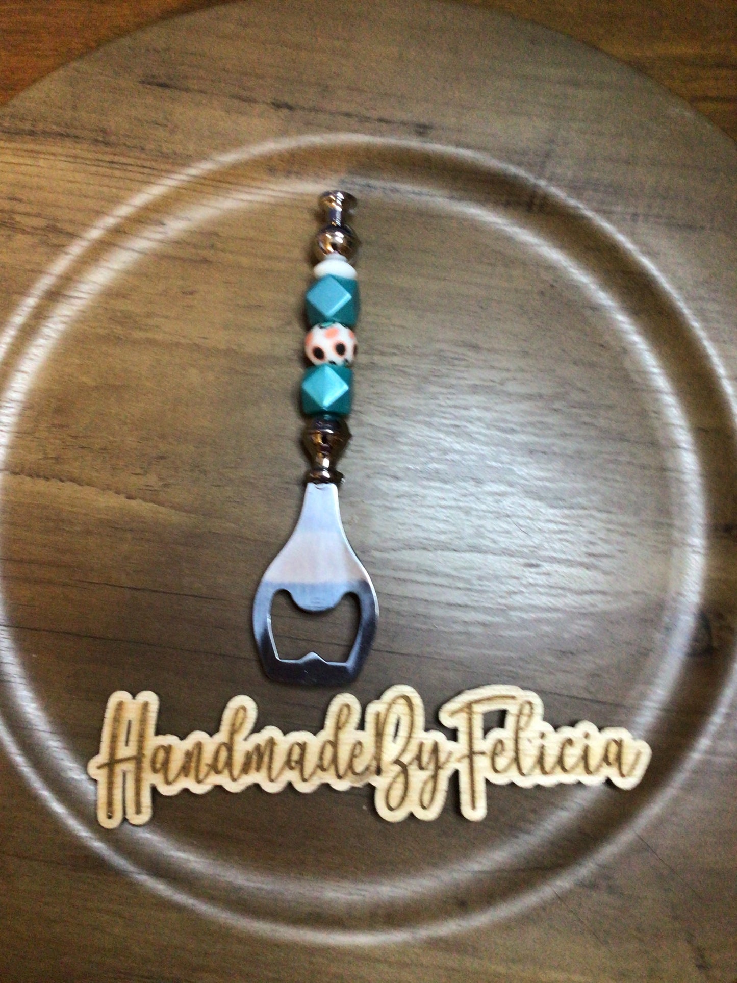 Teal and orange bottle opener