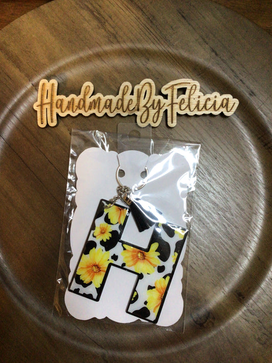 Letter H sunflower and cow print keychain