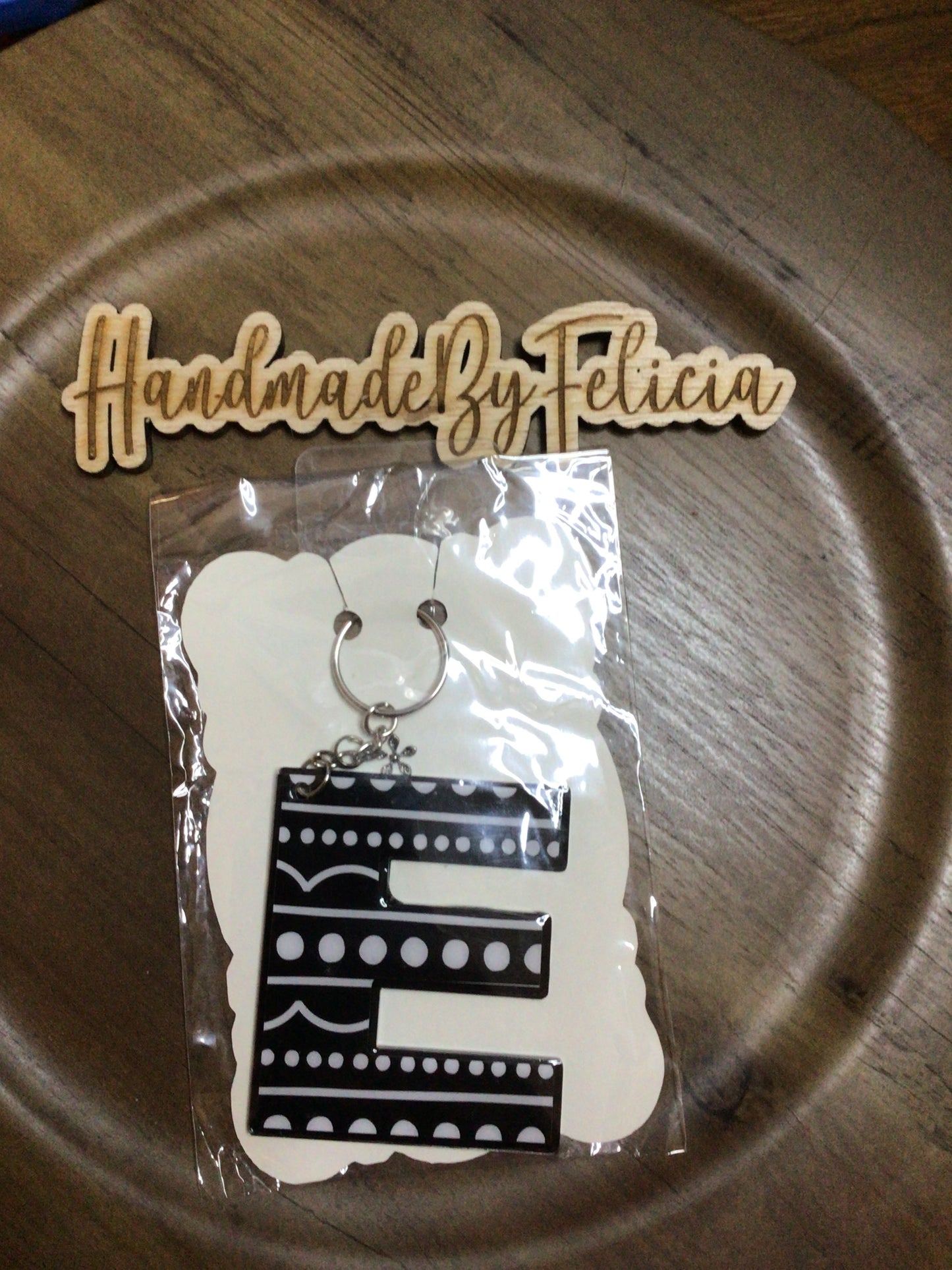 Black dot letter E acrylic keychain