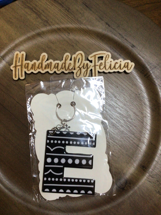 Black dot letter E acrylic keychain