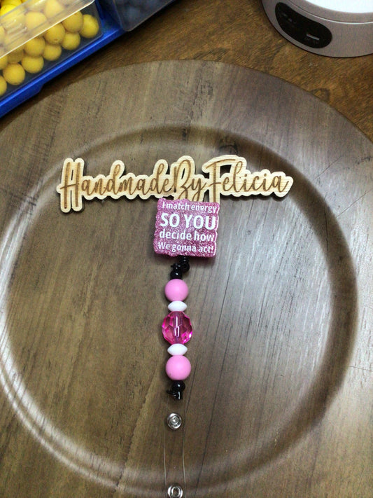 I match energy pink badge reel
