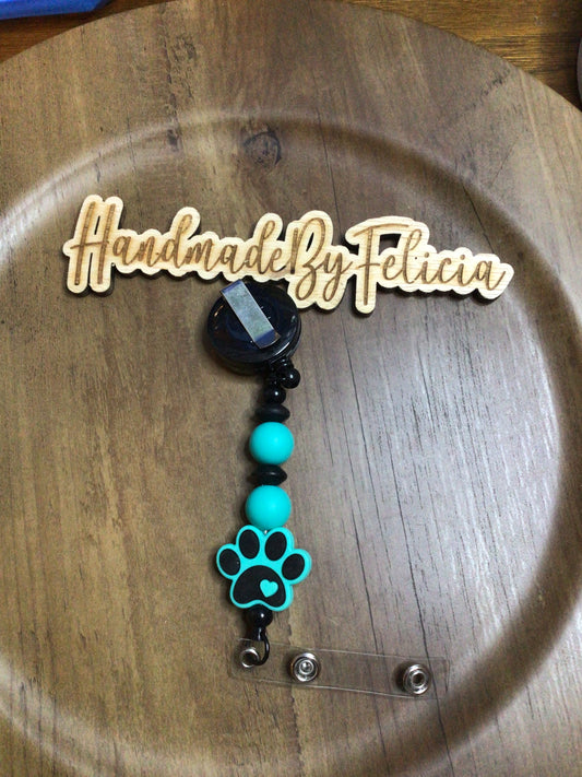 Teal and black paw keychain