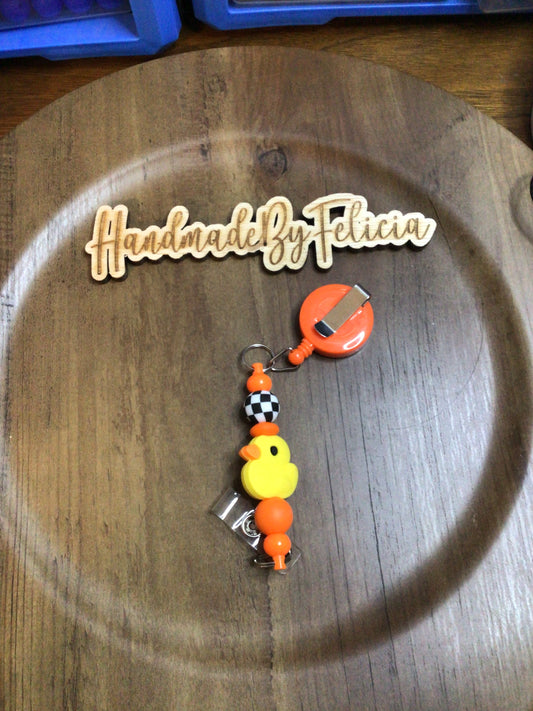Duck orange badge reel