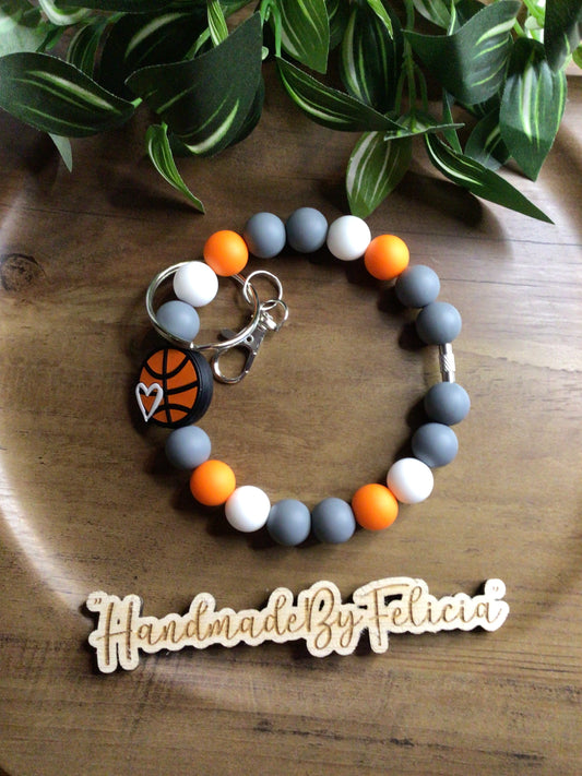 Orange white and grey basketball wristlet