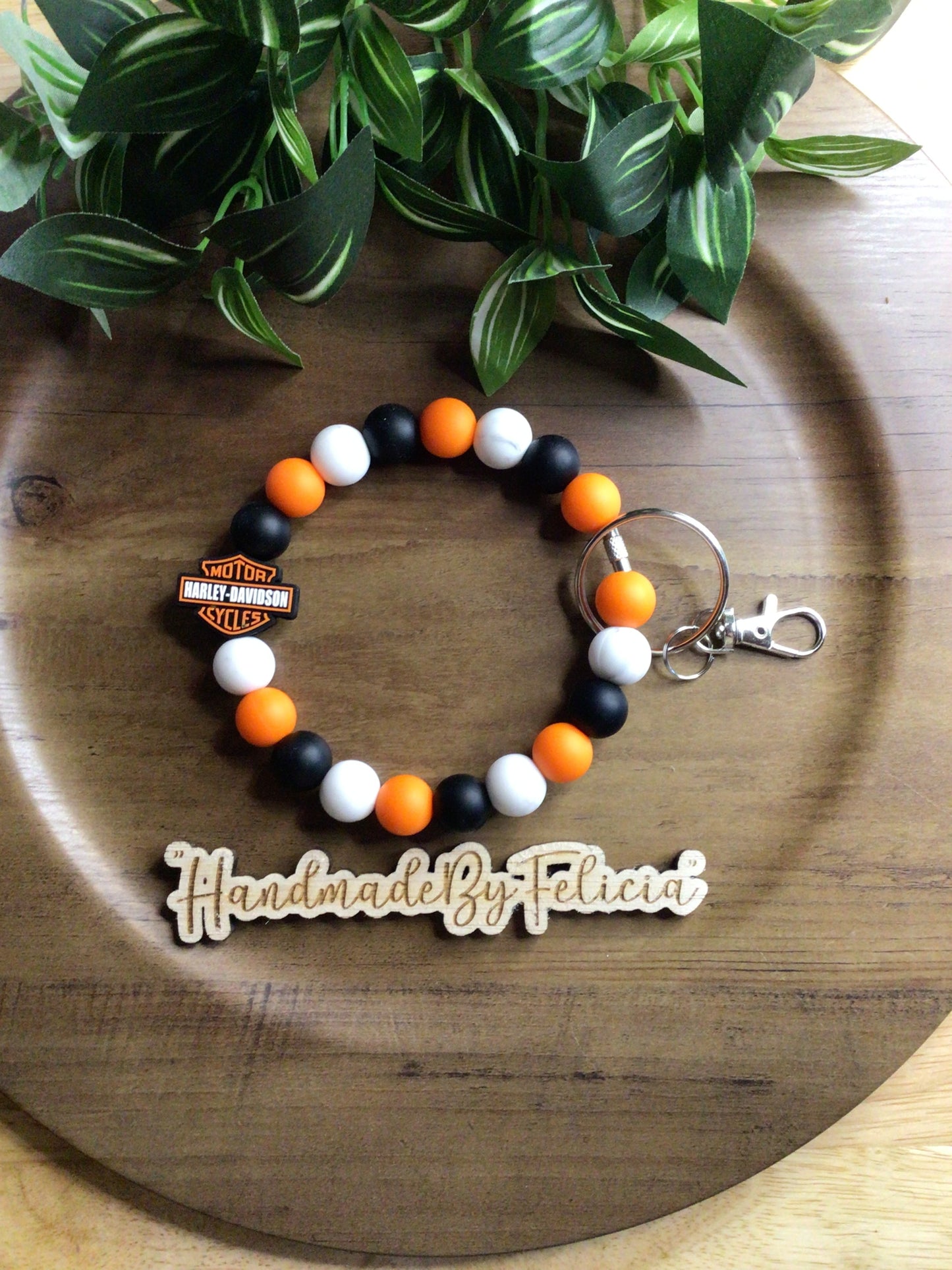 Orange, black and white motorcycle wristlet