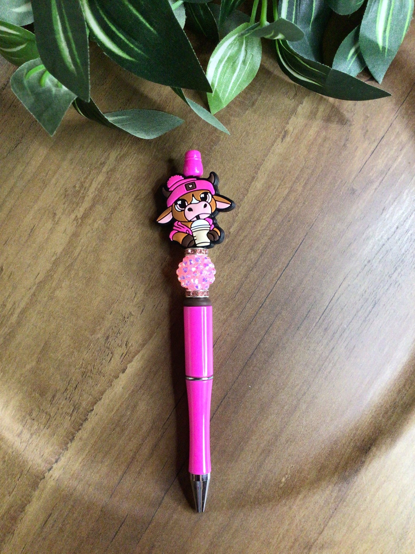 Pink cow with pink pen