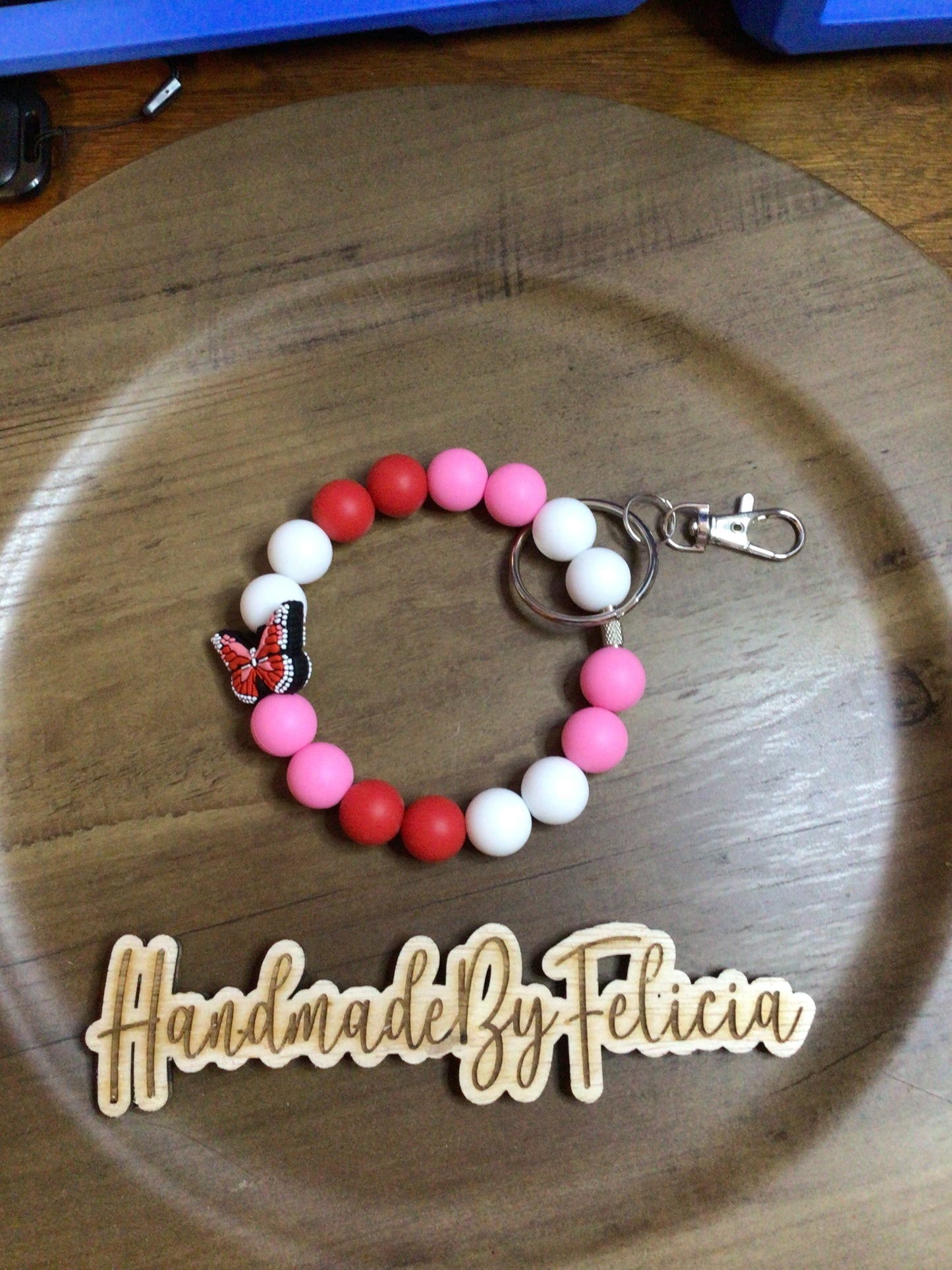 Pink and red butterfly wristlet