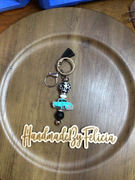 Turquoise truck cow keychain