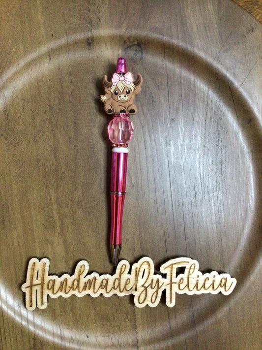 Pink heifer with bow pen