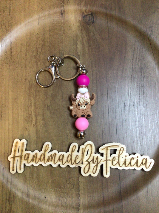 Pink bow heifer girl badge reel