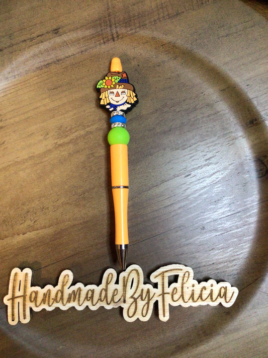 Scarecrow orange pen