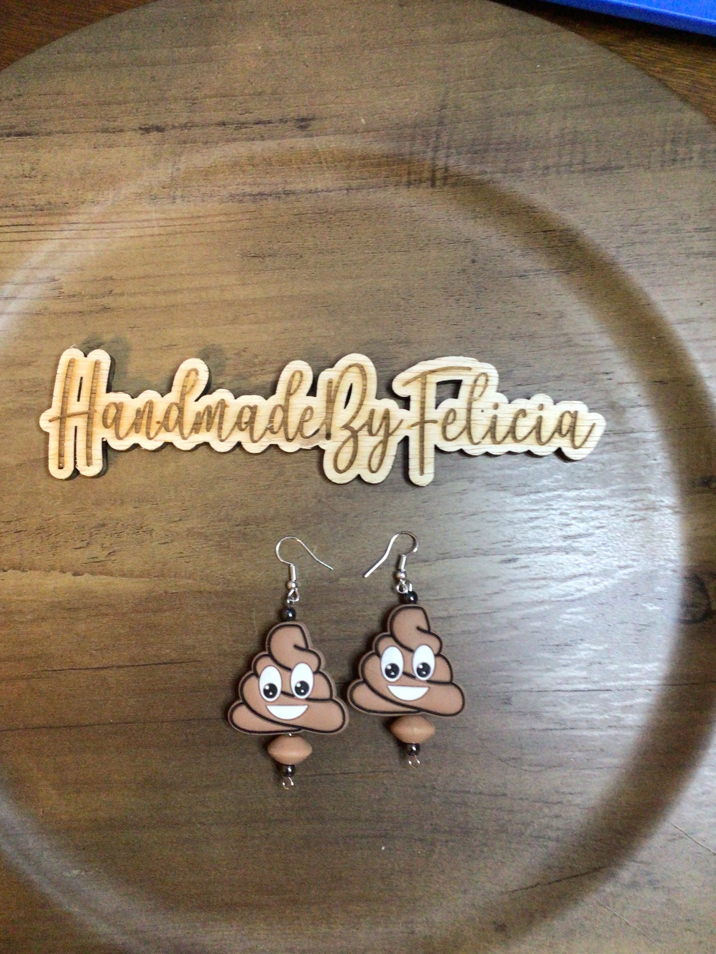 Poop emoji earrings