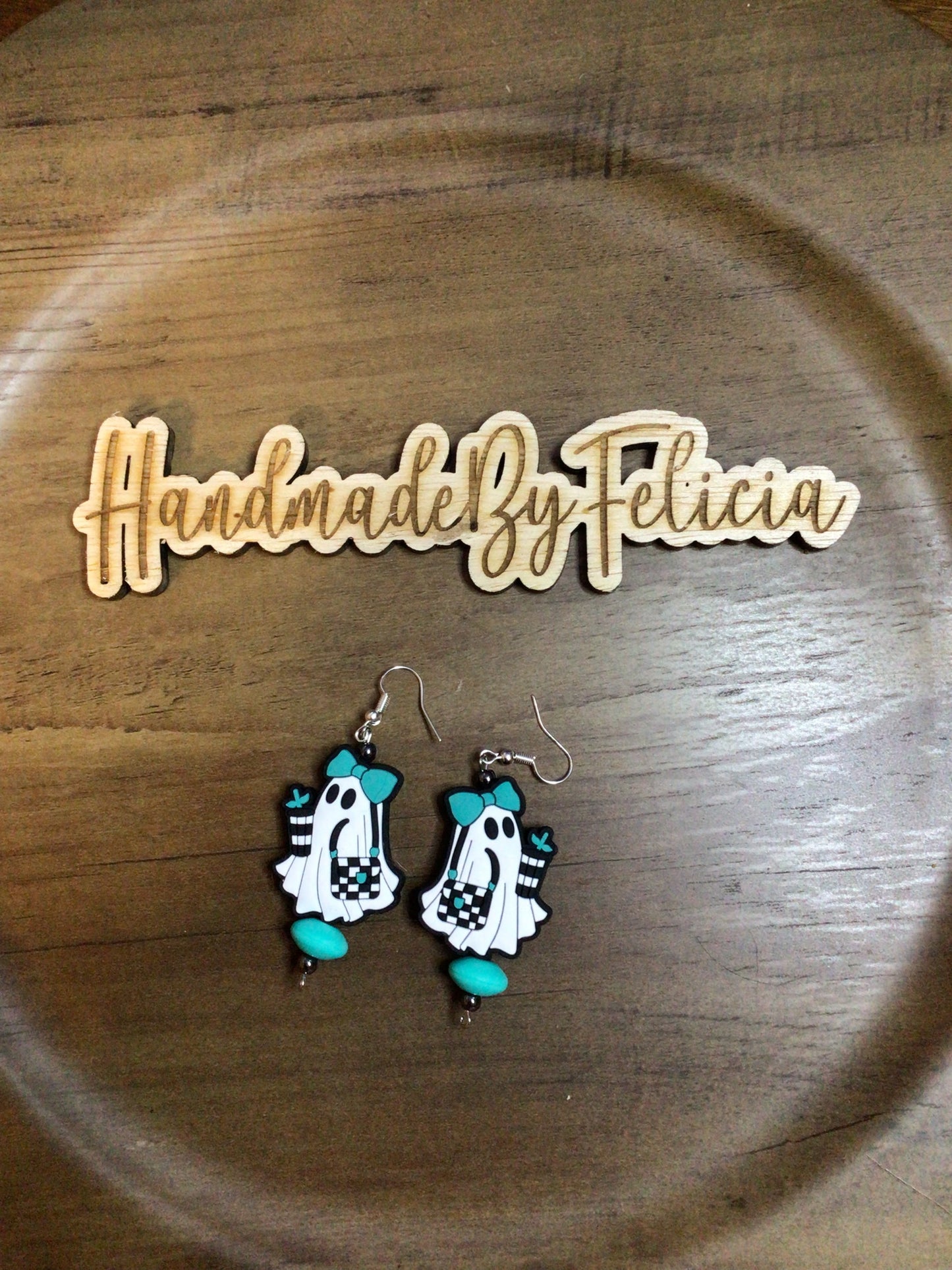 Teal ghost earrings