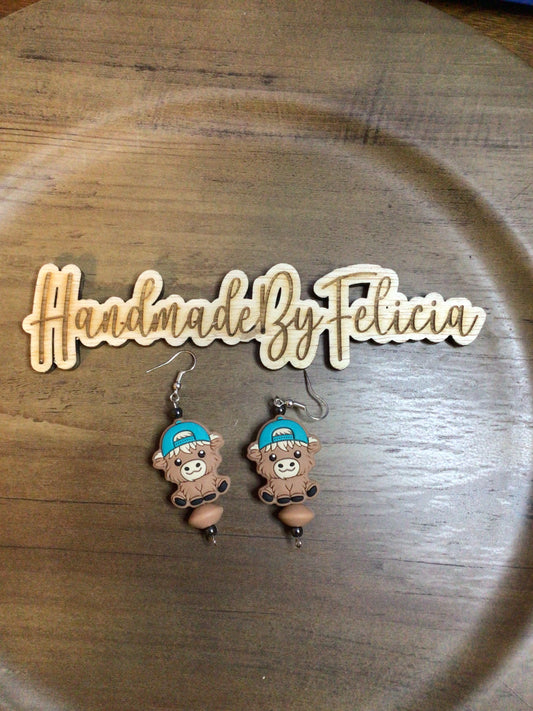 Teal and tan cow earrings