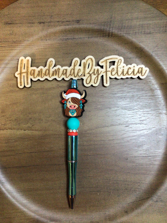 Turquoise heifer with Santa hat pen