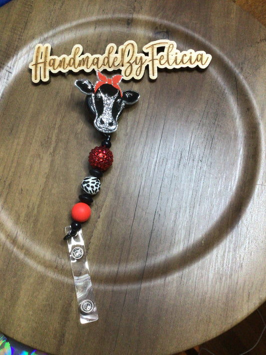 Cow badge reel red black
